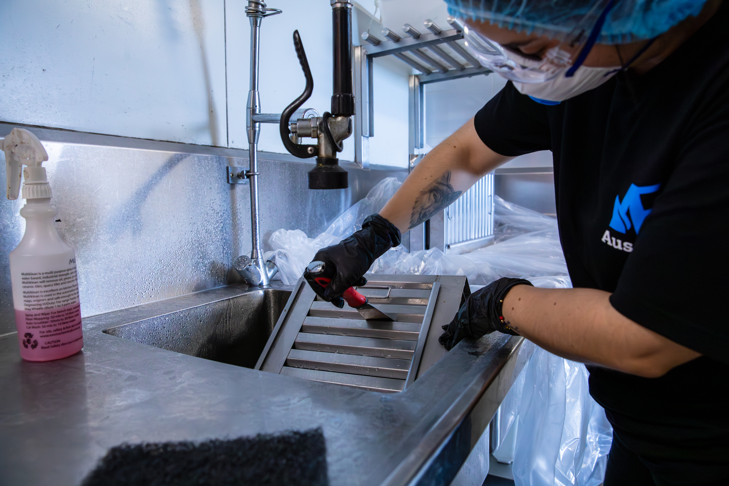 HVAC technician performing maintenance and inspection on commercial air handling equipment